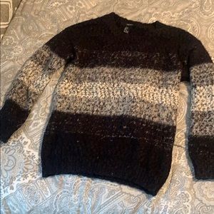 Grey, black and white sweater.